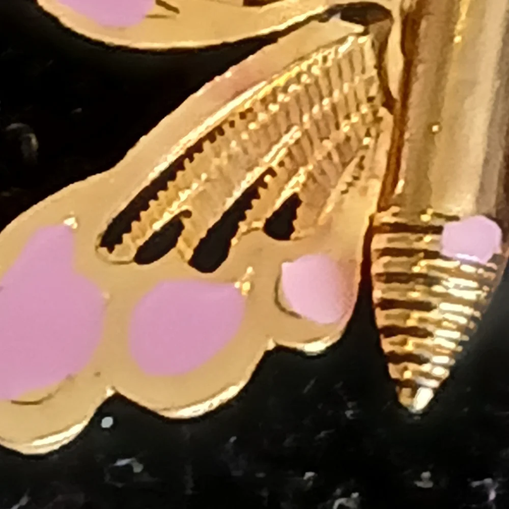 Vintage goldtone filigree butterfly brooch with pink accents